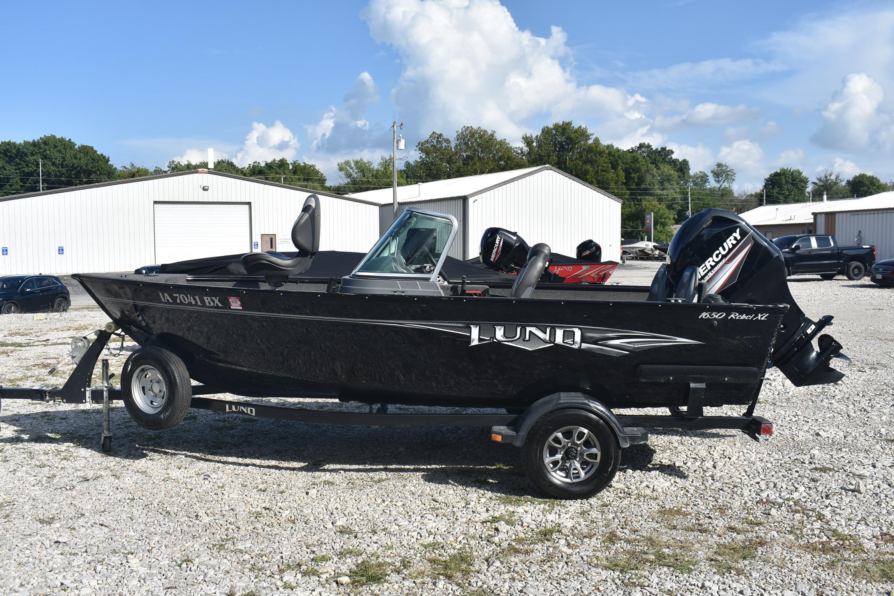 Lund 1650 Rebel XL Sport 2014 Lund 1650 Rebel XL Sport boat on trailer, parked outdoors.
