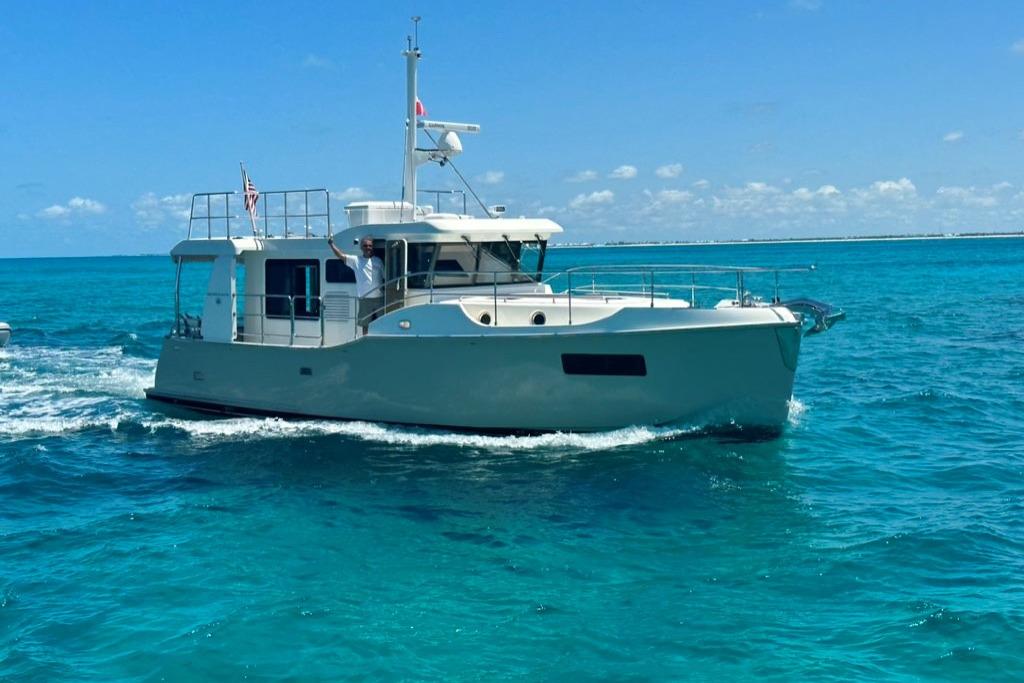 Nordhavn 41 2022 Nordhavn 41 yacht cruising on clear blue ocean waters.