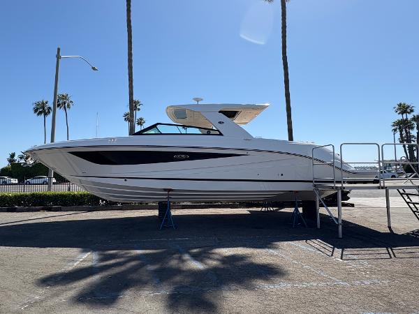 Sea Ray SLX 400 2025 Sea Ray SLX 400 boat on display under clear blue sky.