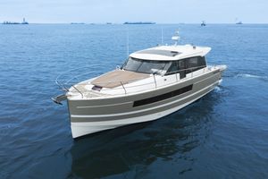 Jeanneau NC 14 2014 Jeanneau NC 14 yacht cruising on open water.
