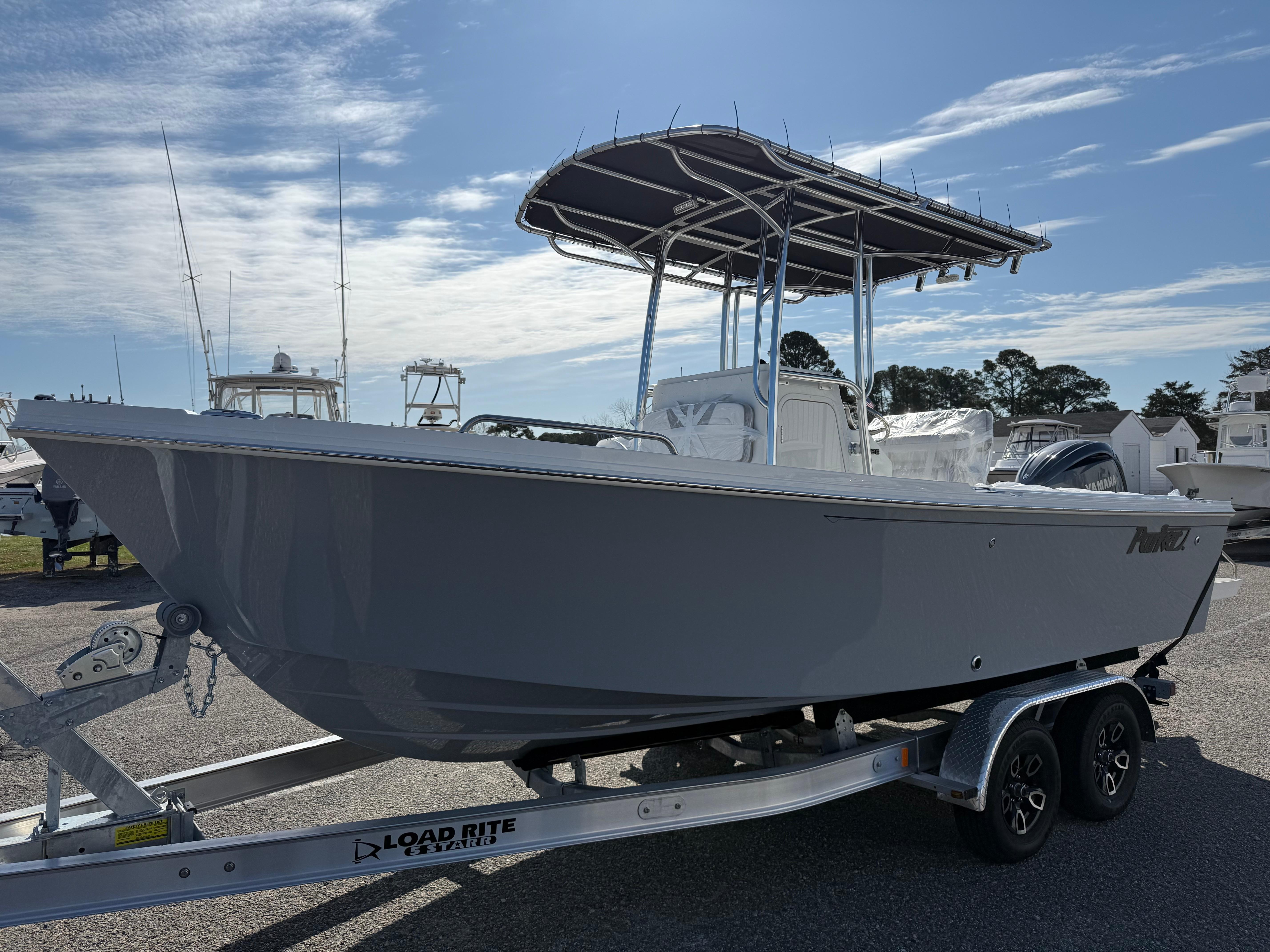 Parker 21 Special Edition 2025 Parker 21SE boat on Load Rite trailer under clear sky.