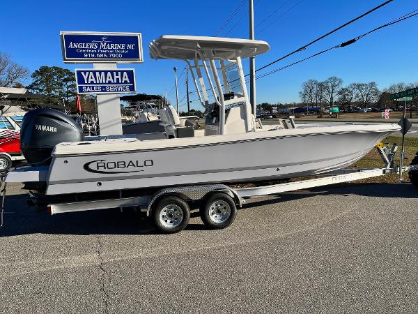 Robalo 246 Cayman 2024 Robalo 246 Cayman boat on trailer at Angler's Marine NC dealership.