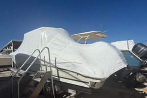 Boston Whaler 270 Vantage 2018 Boston Whaler 270 Vantage boat covered in protective wrap, parked outdoors.