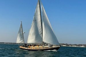 Cheoy Lee Offshore 47 Yawl 1972 Cheoy Lee Offshore 47 Yawl sailing on open water under clear blue skies.