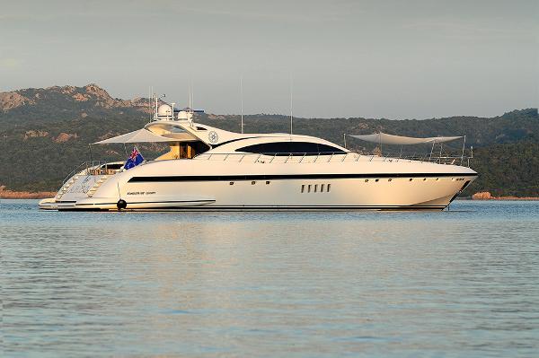 Mangusta 108 Luxurious 2005 Mangusta 108 yacht on calm waters with scenic backdrop.