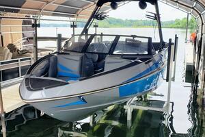 Axis T23 2020 Axis T23 boat in dock, featuring sleek design and blue accents.