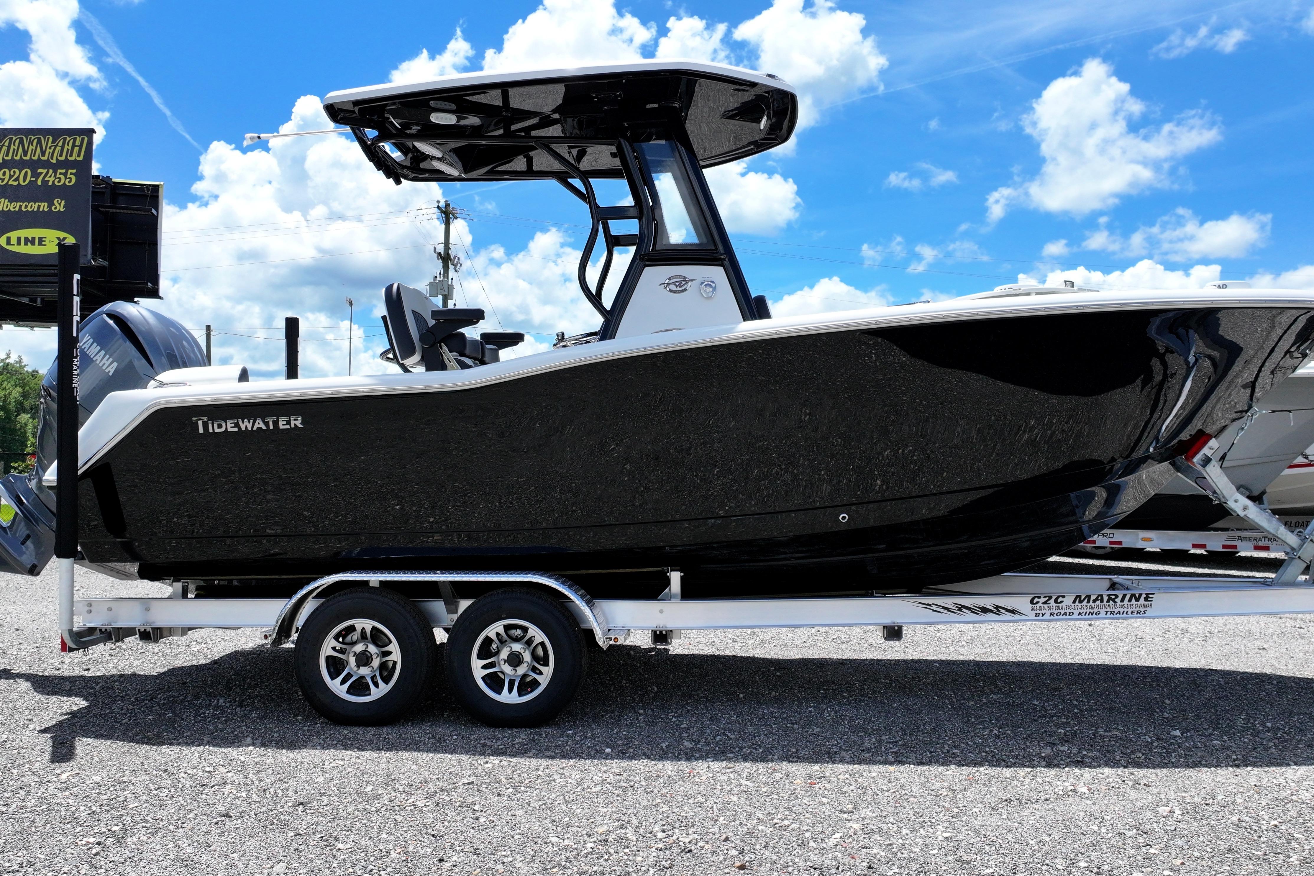 Tidewater 232 LXF 2026 Tidewater 232 LXF boat on trailer under blue sky.