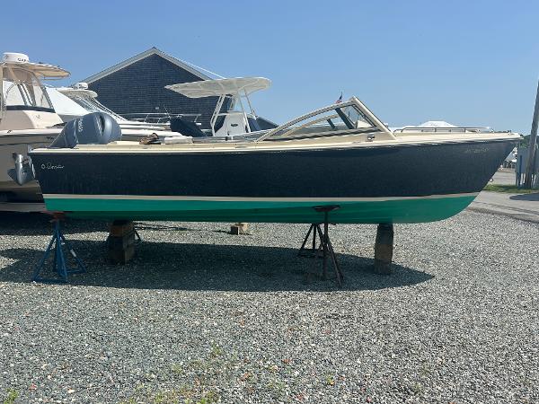 Rossiter 20 Coastal Cruiser 2018 Rossiter 20 Coastal Cruiser boat on stands, displayed outdoors on gravel.