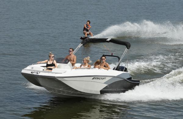 Starcraft SVX211 2023 Starcraft SVX211 boat with passengers enjoying water activities.