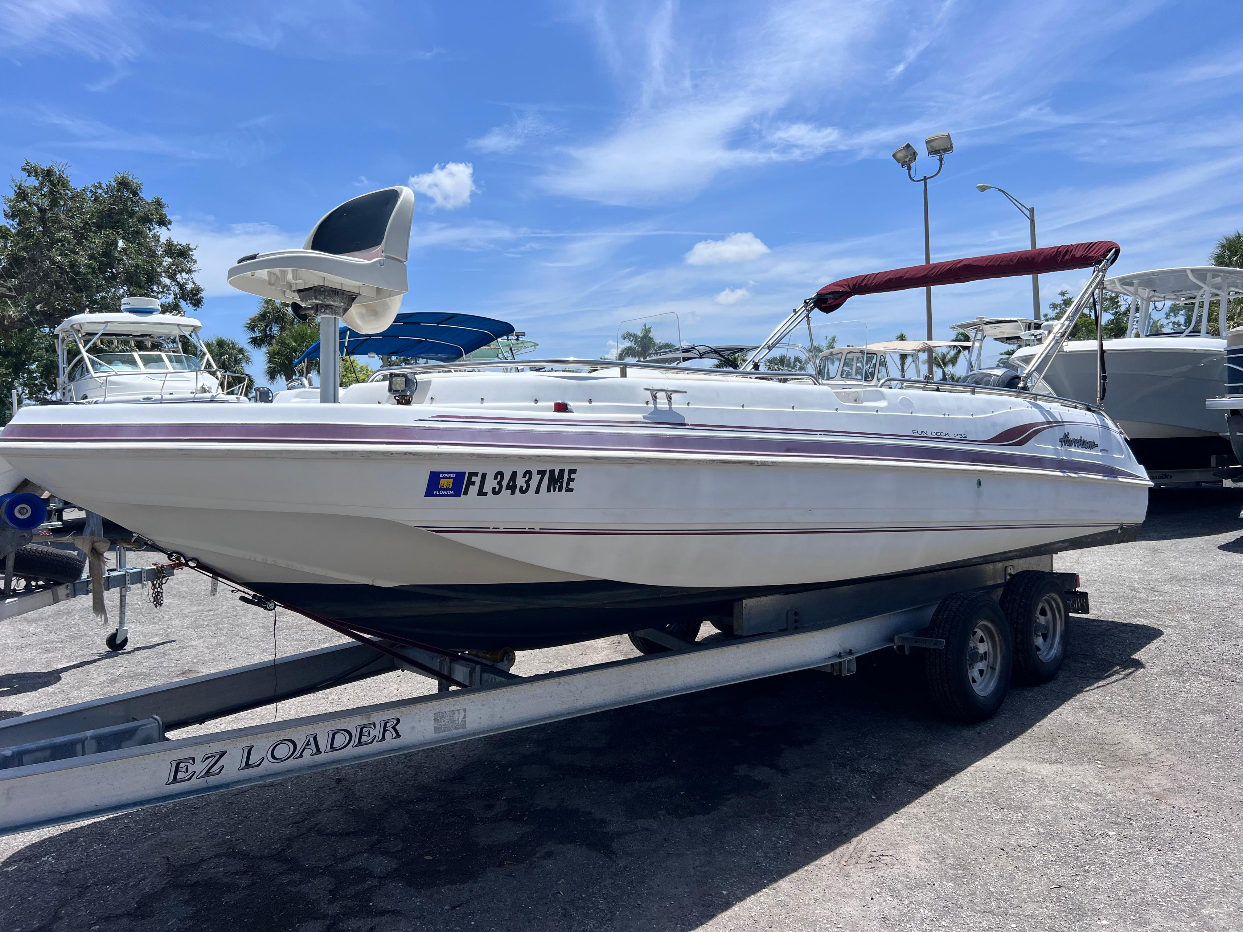 Hurricane FunDeck GS 232 OB 2000 Hurricane FunDeck GS 232 OB boat on trailer under clear blue sky.