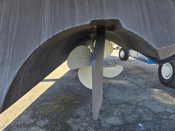 White Formula 48pc Close-up of a 2005 White Formula 48pc boat propeller on dry dock.