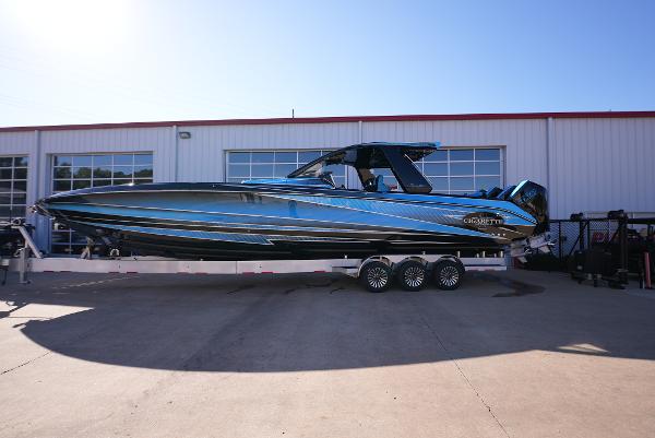 Cigarette 41 Nighthawk 2025 Cigarette 41 Nighthawk boat on a trailer outside a garage.