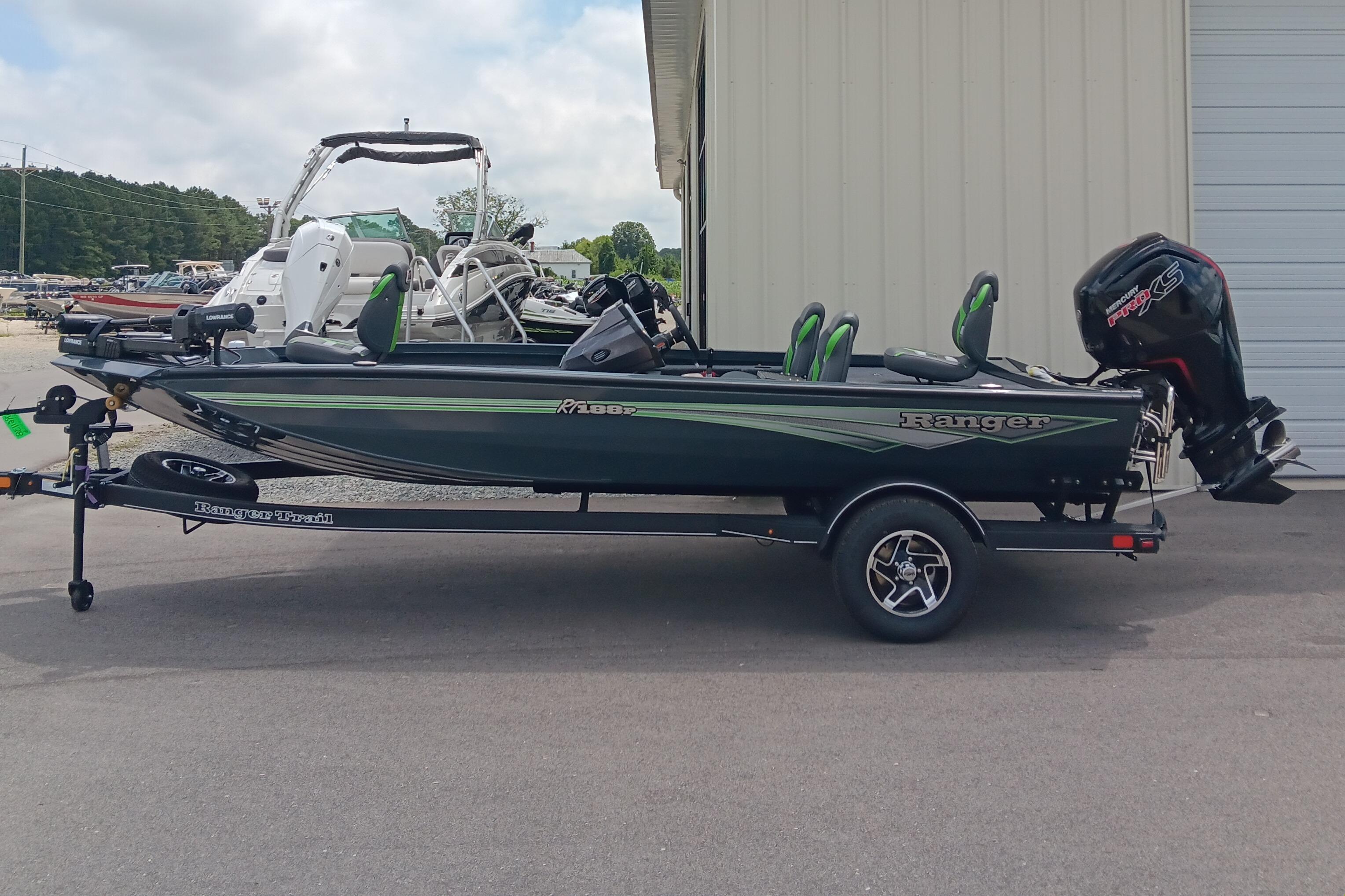 Ranger RT188P 2025 Ranger RT188P fishing boat on trailer, parked outdoors near other boats.