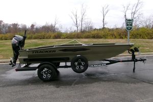 Tracker Grizzly 1650 T Prairie Wings Edition 2026 Tracker Grizzly 1650 T Prairie Wings Edition boat on trailer, parked outdoors.