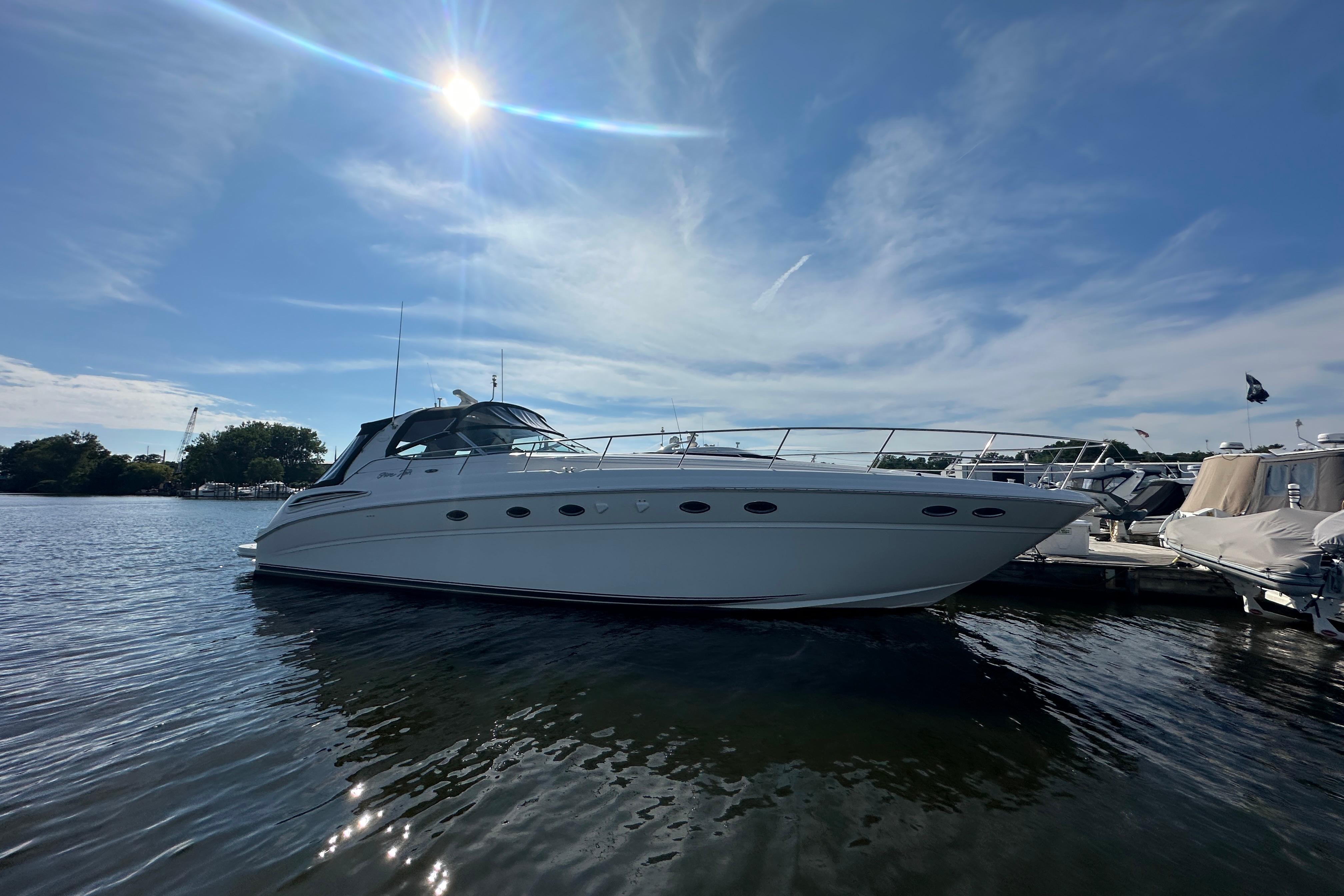 Sea Ray 510 Sundancer 2001 Sea Ray 510 Sundancer yacht docked under a sunny sky.