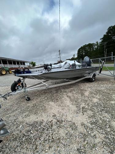 Xpress H20 Bass 2025 Xpress H20 Bass boat on trailer, parked outdoors under cloudy sky.