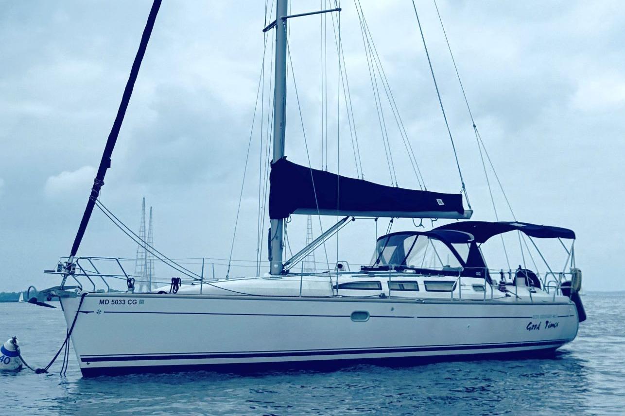 Jeanneau Sun Odyssey 40.3 2005 Jeanneau Sun Odyssey 40.3 sailboat on calm water under cloudy sky.