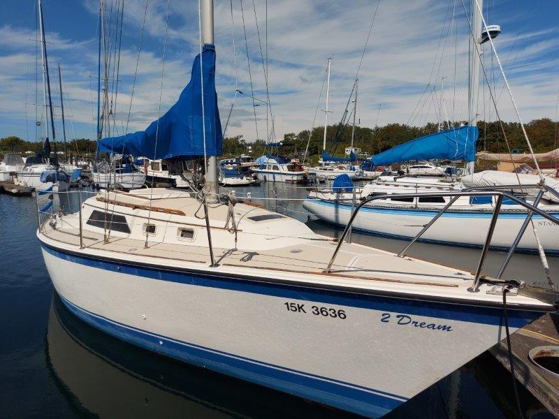 O'Day 28 1982 O'Day 28 sailboat named "2 Dream" docked in a marina.