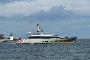 Feadship EXCELLENCE V Luxury yacht Feadship EXCELLENCE V, 2014, cruising near a lighthouse under cloudy skies.
