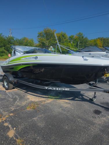 Tahoe T16 2024 Tahoe T16 boat on trailer, parked outdoors, sunny day.