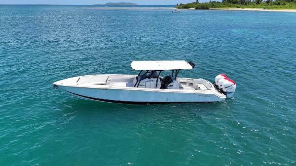 Nor-Tech 390 Sport Center Console 2019 Nor-Tech 390 Sport Center Console boat on clear blue water.