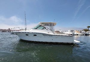 Tiara Yachts 3200 Open 2008 Tiara Yachts 3200 Open, white, docked in marina under clear blue sky.