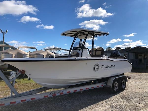 Reflex Gladiator 2024 Reflex Gladiator boat on trailer under blue sky.