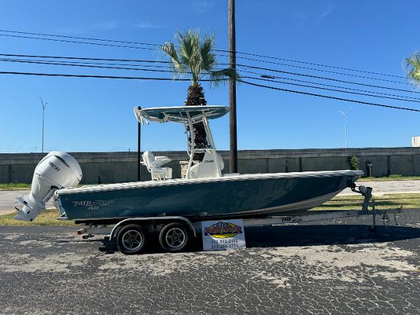Pathfinder 2500 Hybrid 2025 Pathfinder 2500 Hybrid boat on trailer, parked outdoors under clear blue sky.