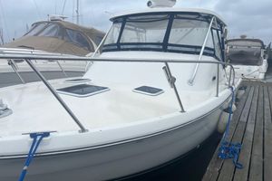 Pursuit 3000 Offshore 2001 Pursuit 3000 Offshore boat docked at marina, featuring sleek design and spacious deck.