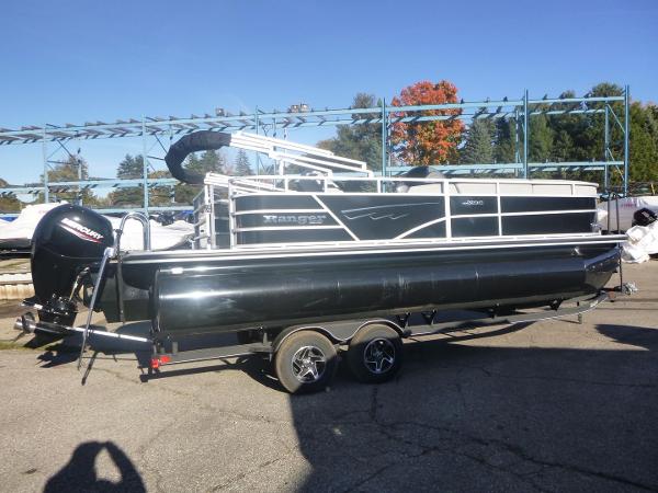 Ranger Reata 223C 2024 Ranger Reata 223C pontoon boat on trailer, outdoors, sunny day.