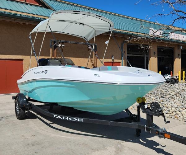 Tahoe T16 2025 Tahoe T16 boat with canopy on trailer, parked outside a building.