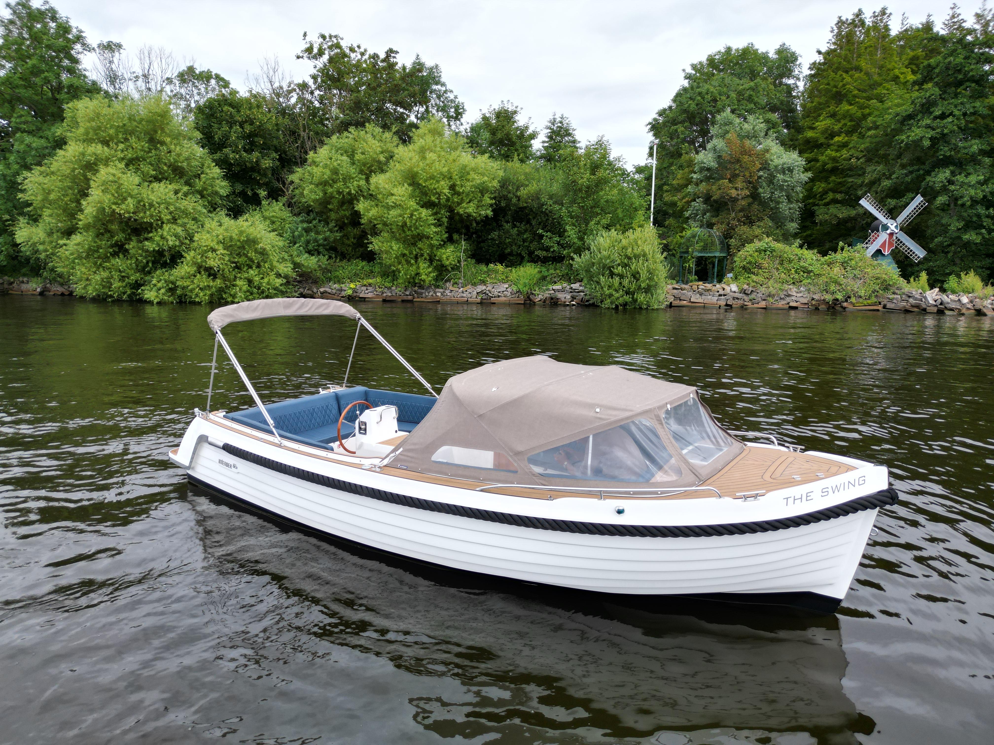 Interboat Intender 820 2022 Interboat Intender 820 on a serene river with lush greenery backdrop.