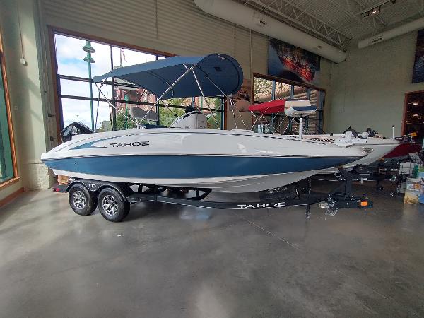 Tahoe 2150 2024 Tahoe 2150 boat with blue and white design in showroom.