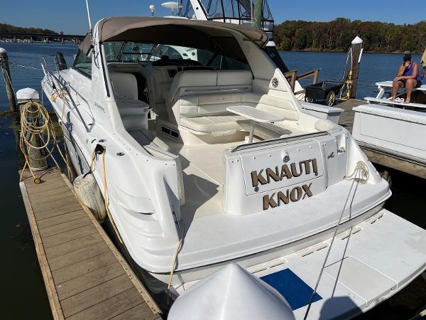 Sea Ray 370 Sundancer 1997 Sea Ray 370 Sundancer docked, featuring spacious seating and sleek design.