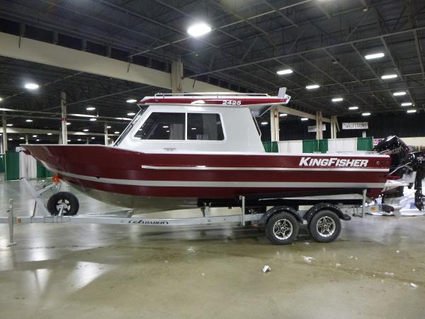 KingFisher 2425 Escape HT 2025 KingFisher 2425 Escape HT boat on trailer in indoor showroom.