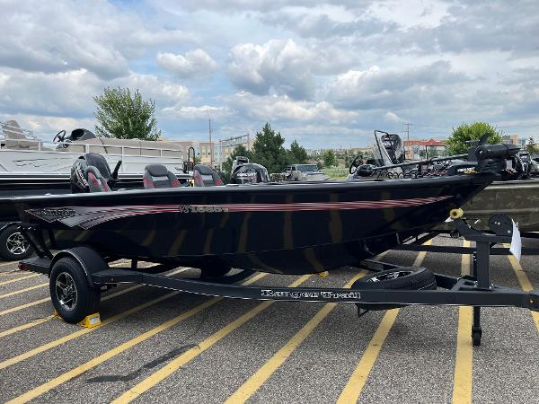 Ranger VS1665T 2024 Ranger VS1665T fishing boat on trailer in parking lot.