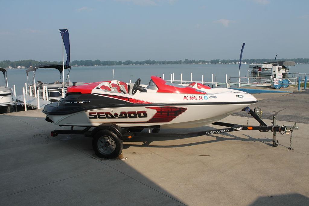 Sea-Doo Speedster 150 2007 Sea-Doo Speedster 150 on trailer by lakeside dock.