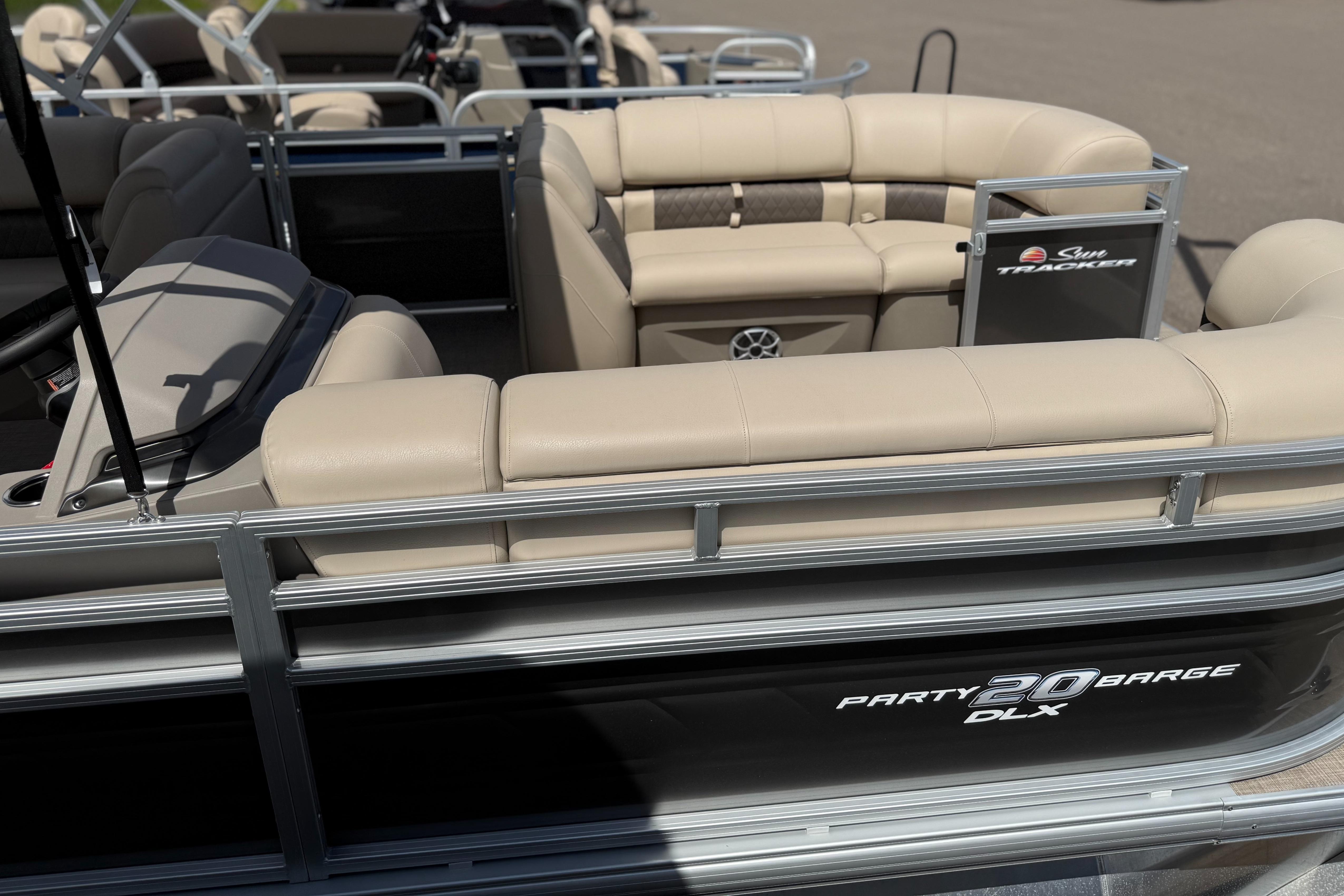 Sun Tracker Party Barge 20 DLX 2024 Sun Tracker Party Barge 20 DLX pontoon boat with beige seating and sleek design.