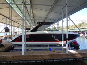 Cobalt R30 2017 Cobalt R30 boat docked under a covered marina.