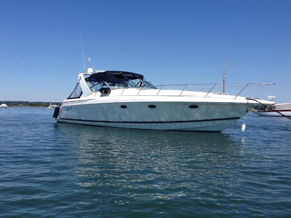Formula 41 PC 1998 Formula 41 PC yacht on calm water under clear blue sky.