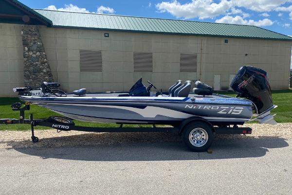 Nitro Z19 Pro 2025 Nitro Z19 Pro boat parked outdoors on a trailer, under a clear blue sky.