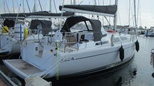 Hanse 348 2023 Hanse 348 yacht docked in marina, featuring sleek design and modern amenities.