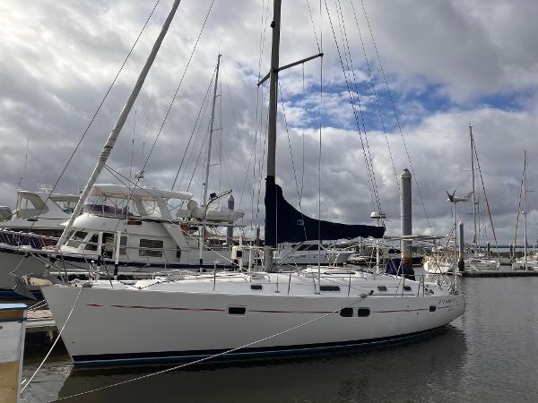 Beneteau America Oceanis 411 1998 Beneteau America Oceanis 411 sailboat docked in a marina under cloudy skies.