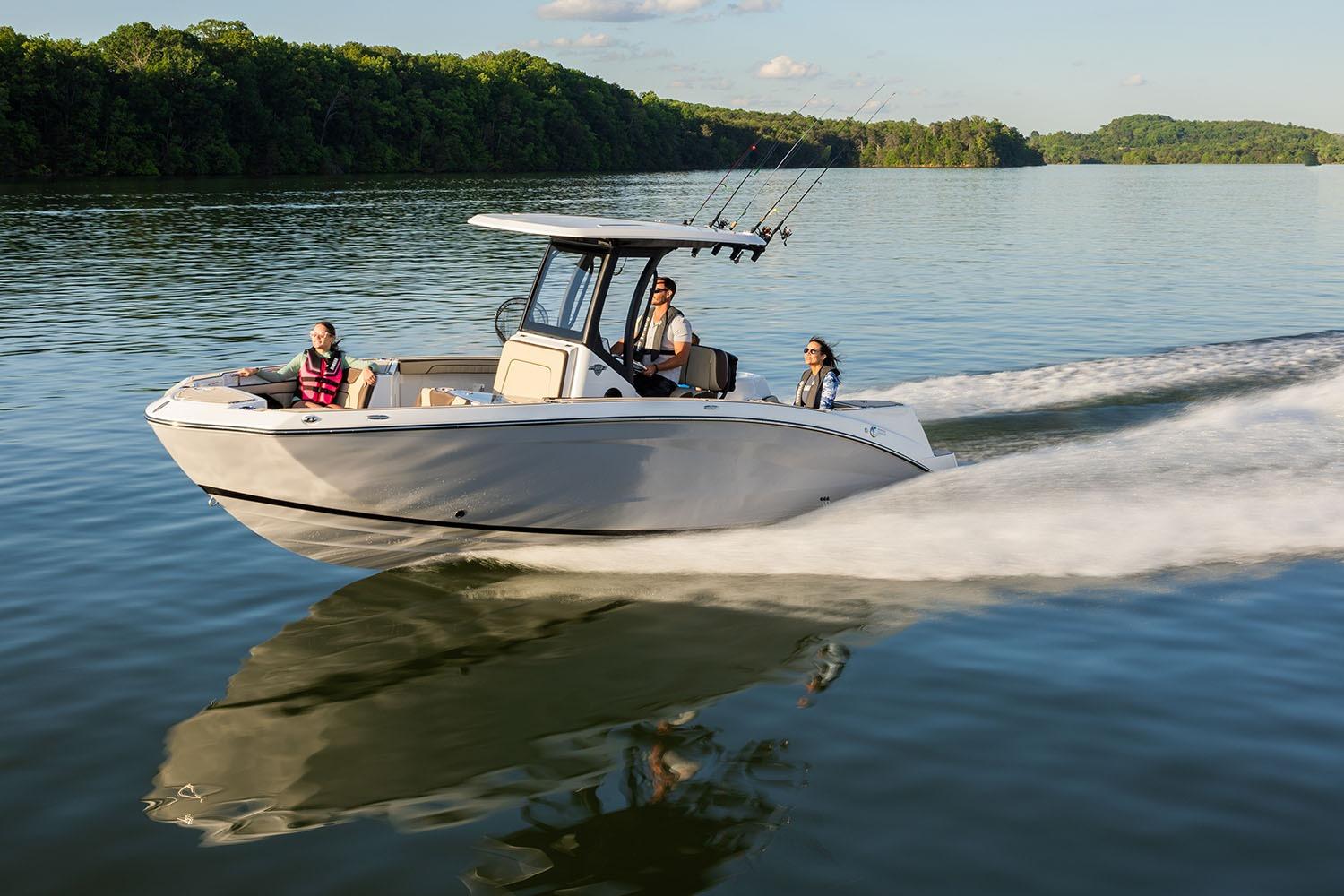 Yamaha Boats 255 FSH Sport H Manufacturer Provided Image: 2026 Yamaha Boats 255 FSH Sport H cruising on a serene lake with passengers.