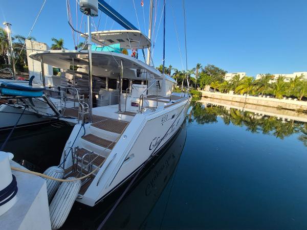 Lagoon 450 Lagoon 450 catamaran docked in a serene marina, 2014 model.