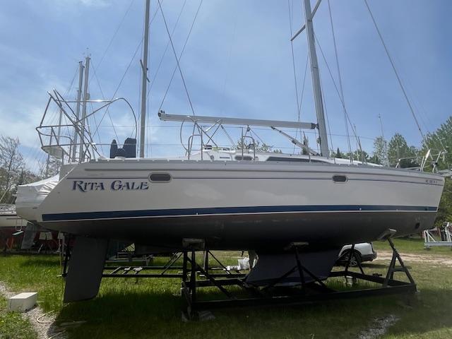 Catalina 355 2012 Catalina 355 sailboat on a stand, named "Rita Gale," in a grassy area.