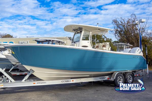 Cobia 285 Center Console 2025 Cobia 285 Center Console boat on trailer at Palmetto Boat Sales.