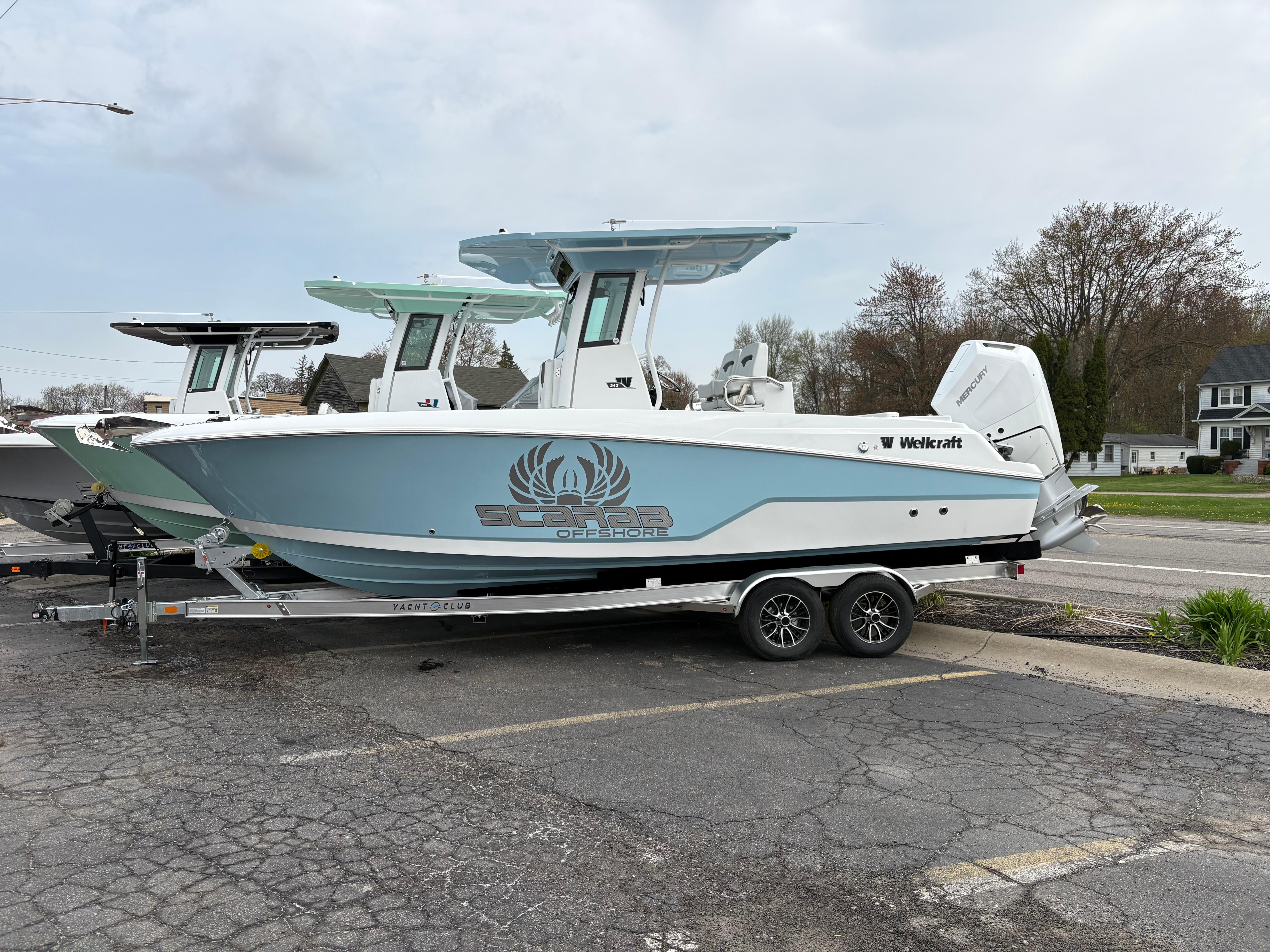 Wellcraft 243 Fisherman 2025 Wellcraft 243 Fisherman boat on trailer, parked outdoors.