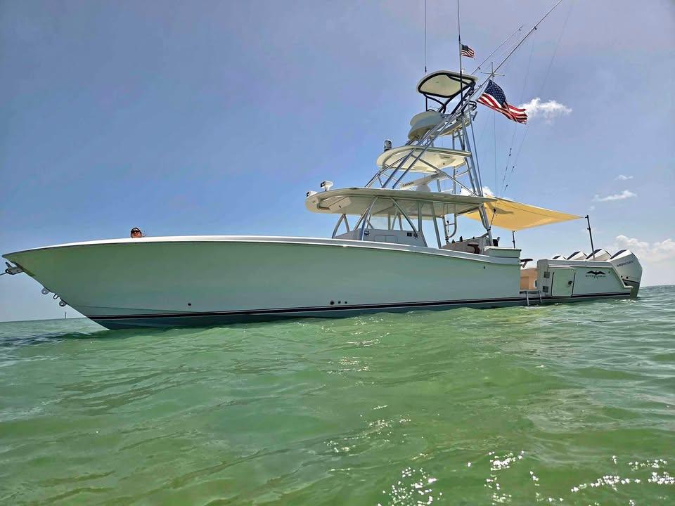 Invincible 42 Open Fisherman 2013 Invincible 42 Open Fisherman boat on calm sea with clear sky.