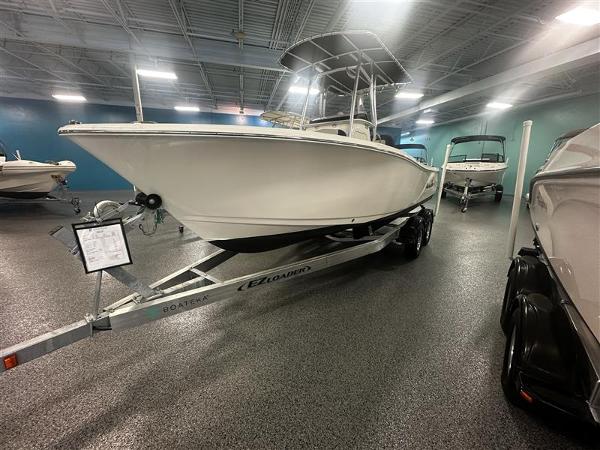 NauticStar 2302 Legacy 2022 NauticStar 2302 Legacy boat on trailer in showroom.